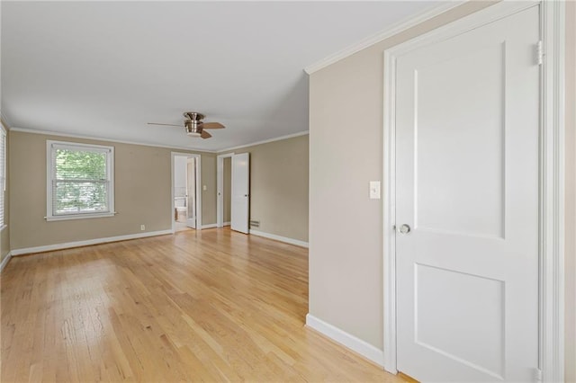 1296 W 72nd Ter, Kansas City, MO 64114 - empty room featuring light wood finished floors, ceiling fan, and ornamental molding