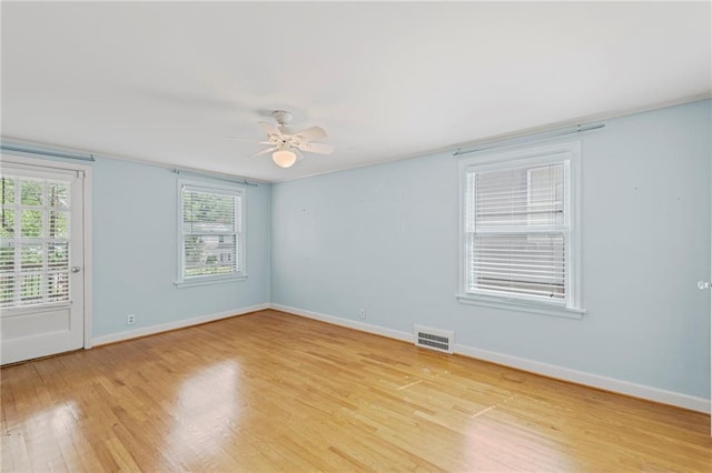 1296 W 72nd Ter, Kansas City, MO 64114 - spare room featuring light wood finished floors and ceiling fan