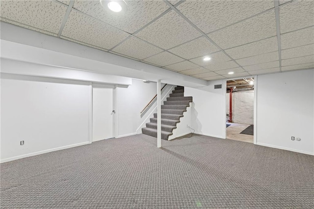 1296 W 72nd Ter, Kansas City, MO 64114 - finished basement featuring stairs, a paneled ceiling, carpet flooring, and recessed lighting