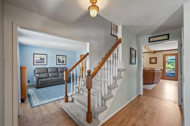 12147 Farley St, Overland Park, KS 66213 - stairs featuring wood finished floors and baseboards