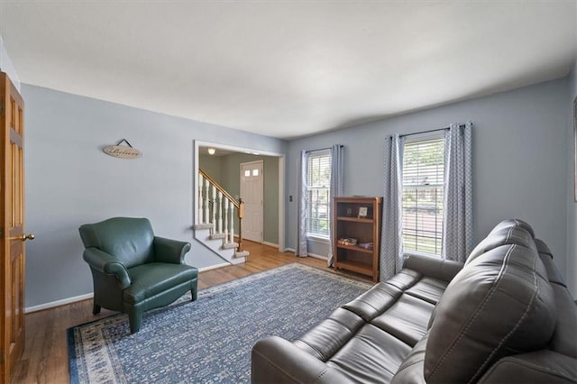 12147 Farley St, Overland Park, KS 66213 - living room featuring stairway and wood finished floors