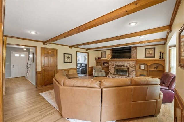 12147 Farley St, Overland Park, KS 66213 - living area featuring light wood-style flooring, recessed lighting, a fireplace, and beamed ceiling