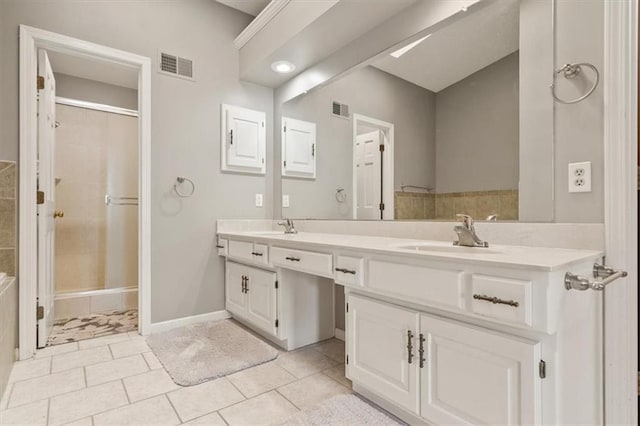 12147 Farley St, Overland Park, KS 66213 - bathroom featuring double vanity, a tile shower, and tile patterned flooring