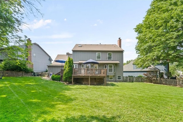 12147 Farley St, Overland Park, KS 66213 - rear view of property featuring a fenced backyard, a chimney, and a wooden deck