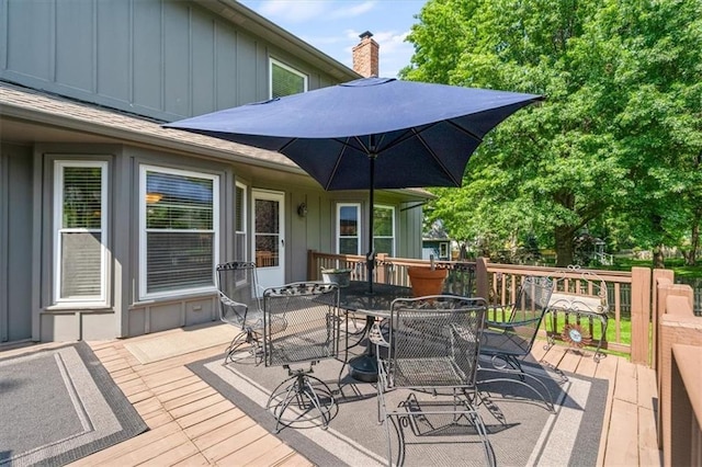 12147 Farley St, Overland Park, KS 66213 - wooden terrace featuring outdoor dining space