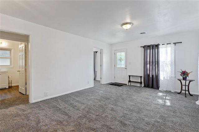 811 S Hickory St, Ottawa, KS 66067 - carpeted spare room with baseboards