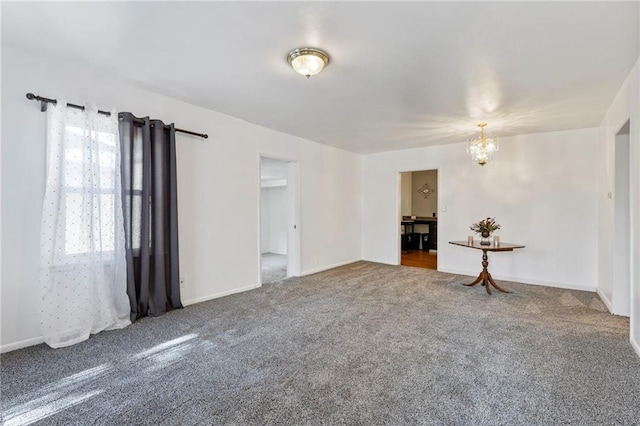 811 S Hickory St, Ottawa, KS 66067 - spare room with a chandelier and carpet floors