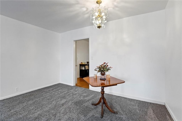 811 S Hickory St, Ottawa, KS 66067 - carpeted empty room with baseboards and a chandelier