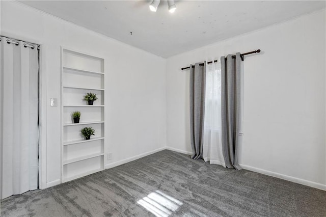 811 S Hickory St, Ottawa, KS 66067 - spare room featuring carpet flooring and built in features