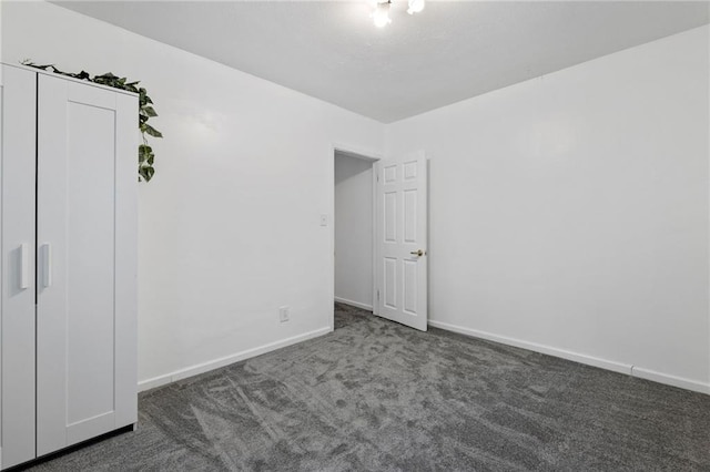 811 S Hickory St, Ottawa, KS 66067 - empty room featuring carpet flooring and baseboards