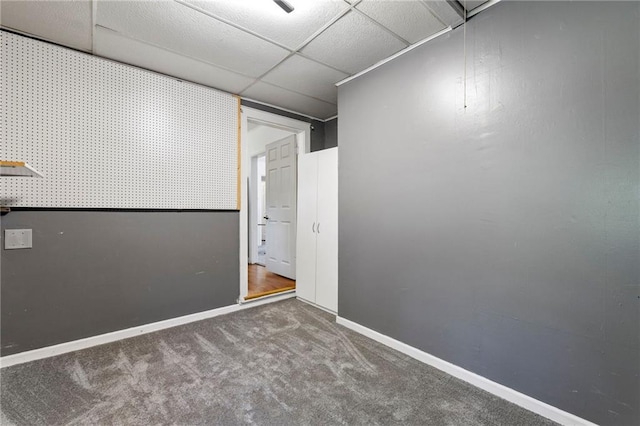 811 S Hickory St, Ottawa, KS 66067 - empty room featuring carpet flooring and a paneled ceiling