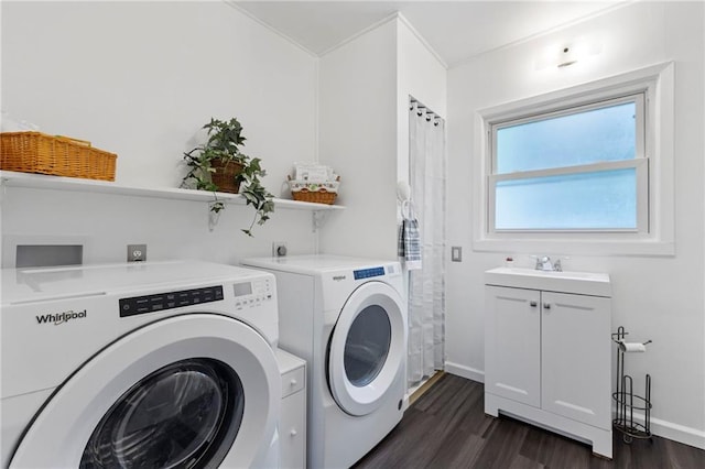 811 S Hickory St, Ottawa, KS 66067 - laundry room featuring cabinet space, washer and dryer, and dark wood-style flooring