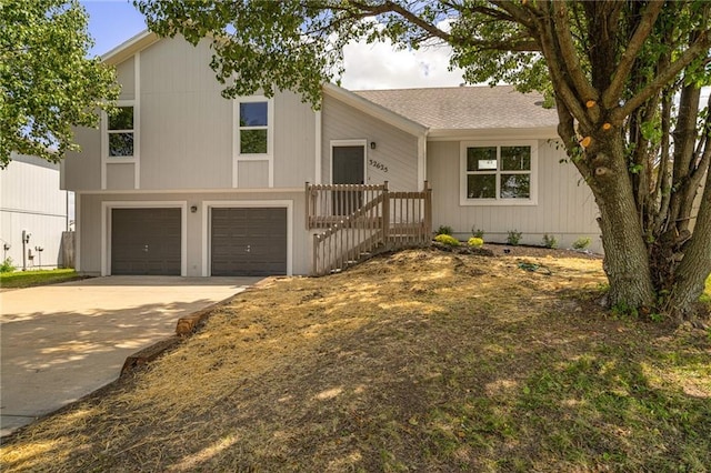32625 W 174th St, Gardner, KS 66030 - view of front of house with driveway, an attached garage, and a shingled roof