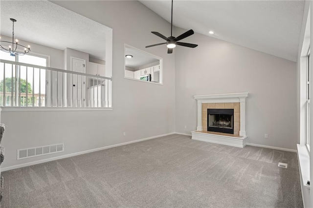 32625 W 174th St, Gardner, KS 66030 - unfurnished living room featuring carpet flooring, a ceiling fan, lofted ceiling, a fireplace, and a chandelier