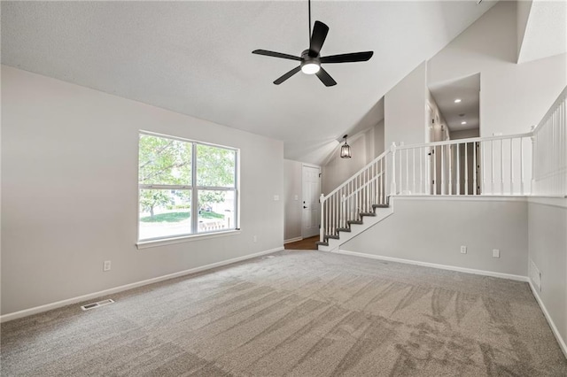 32625 W 174th St, Gardner, KS 66030 - unfurnished living room featuring ceiling fan, carpet flooring, high vaulted ceiling, and stairway