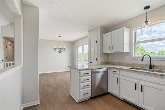 32625 W 174th St, Gardner, KS 66030 - kitchen featuring stainless steel dishwasher, a chandelier, white cabinetry, a textured ceiling, and healthy amount of natural light