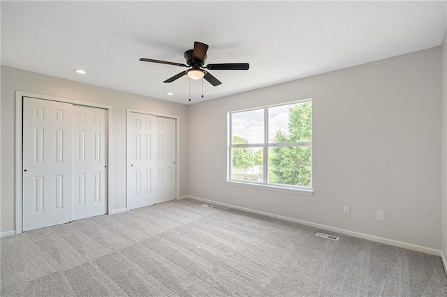 32625 W 174th St, Gardner, KS 66030 - unfurnished bedroom featuring multiple closets, carpet floors, recessed lighting, and a ceiling fan