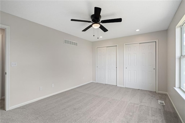 32625 W 174th St, Gardner, KS 66030 - unfurnished bedroom with multiple closets, carpet, recessed lighting, and a ceiling fan