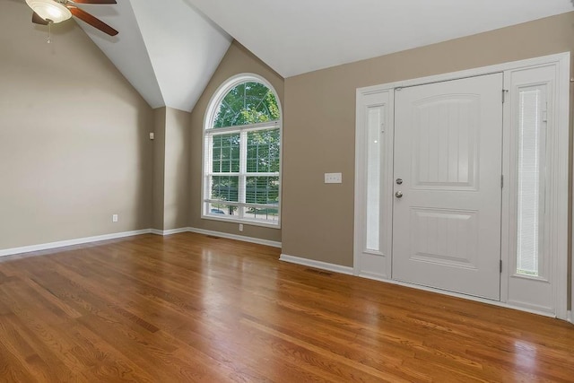 701 Tomahawk Ct, Smithville, MO 64089 - entrance foyer featuring ceiling fan, wood finished floors, and vaulted ceiling