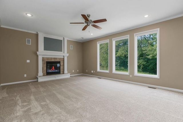 701 Tomahawk Ct, Smithville, MO 64089 - unfurnished living room featuring ornamental molding, ceiling fan, carpet, a tile fireplace, and recessed lighting