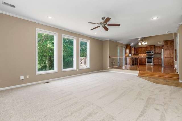 701 Tomahawk Ct, Smithville, MO 64089 - unfurnished living room with a chandelier, crown molding, light carpet, a ceiling fan, and recessed lighting