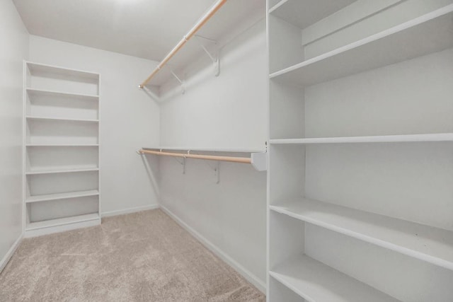 701 Tomahawk Ct, Smithville, MO 64089 - walk in closet featuring carpet