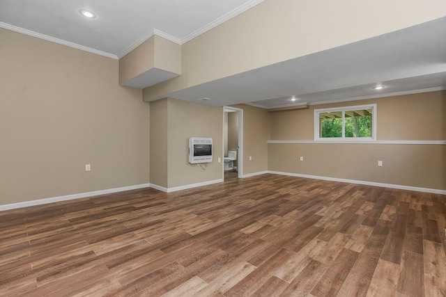 701 Tomahawk Ct, Smithville, MO 64089 - below grade area with heating unit, wood finished floors, ornamental molding, and recessed lighting
