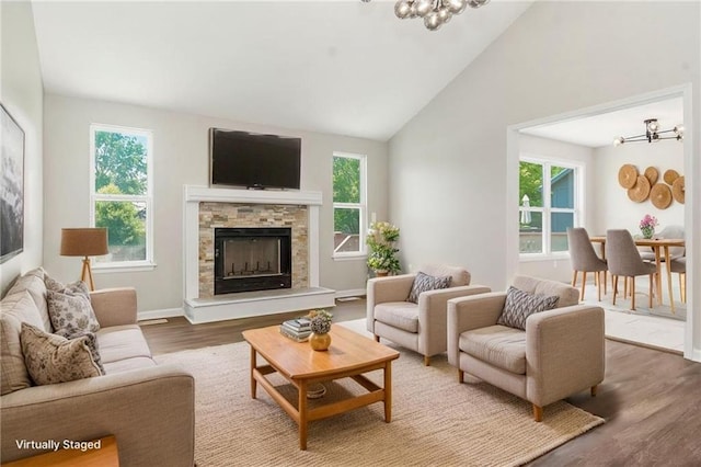 18201 W 157th Ter, Olathe, KS 66062 - living area featuring a chandelier, plenty of natural light, wood finished floors, and high vaulted ceiling