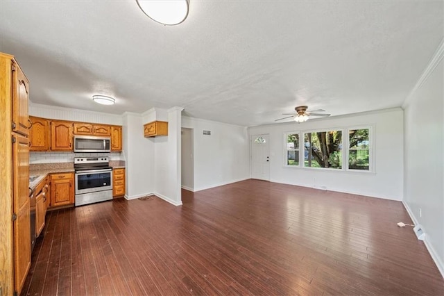 7 Hi View Ridge Dr, Archie, MO 64725 - unfurnished living room with dark wood-style flooring, crown molding, ceiling fan, and a textured ceiling