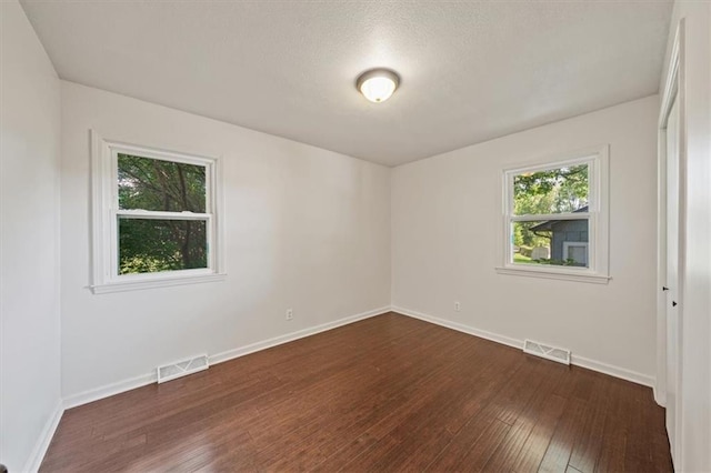 7 Hi View Ridge Dr, Archie, MO 64725 - unfurnished room with dark wood-style floors and baseboards