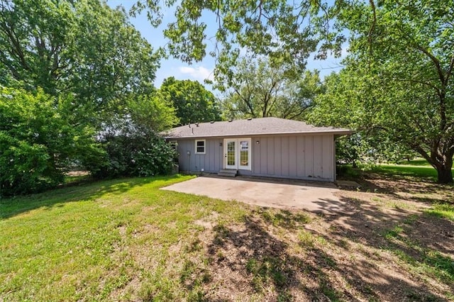 7 Hi View Ridge Dr, Archie, MO 64725 - rear view of house with french doors, board and batten siding, a patio area, and a yard