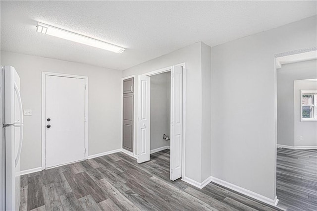 4937 Highland Ave, Kansas City, MO 64110 - interior space featuring wood finished floors and a textured ceiling