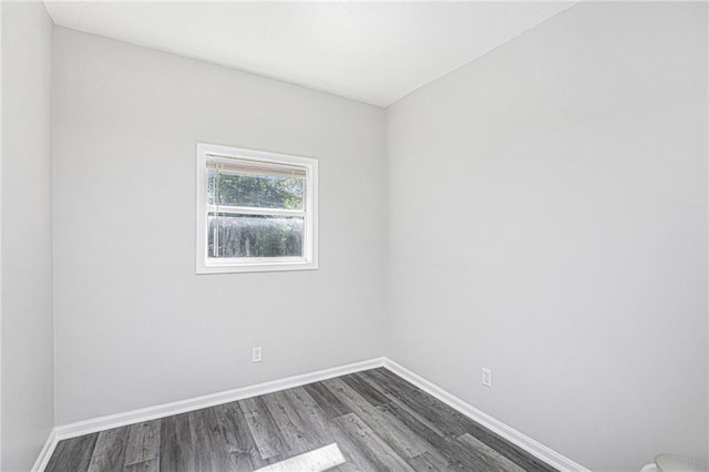 4937 Highland Ave, Kansas City, MO 64110 - empty room with dark wood-type flooring