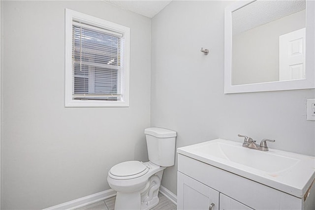 4937 Highland Ave, Kansas City, MO 64110 - bathroom featuring vanity and a textured ceiling