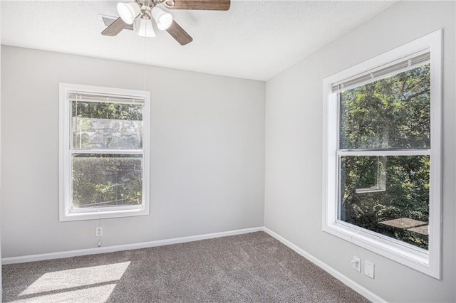 4937 Highland Ave, Kansas City, MO 64110 - unfurnished room featuring a ceiling fan, a textured ceiling, and carpet floors