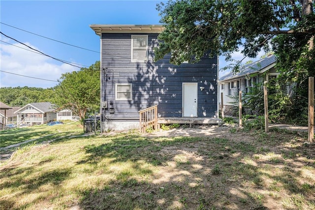 4937 Highland Ave, Kansas City, MO 64110 - rear view of house with a yard