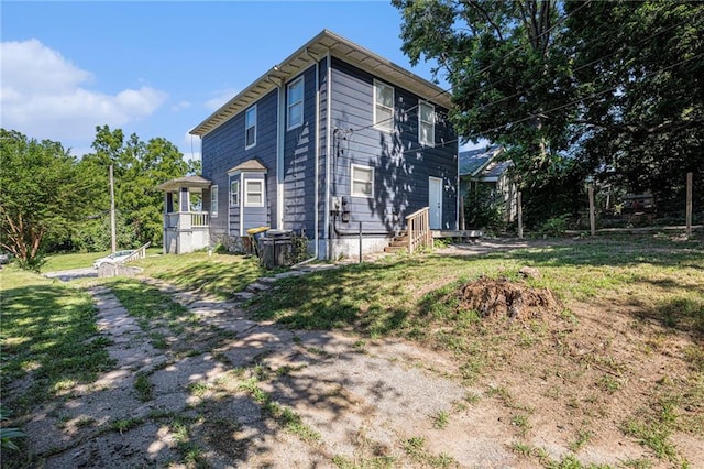 4937 Highland Ave, Kansas City, MO 64110 - view of side of property featuring a yard