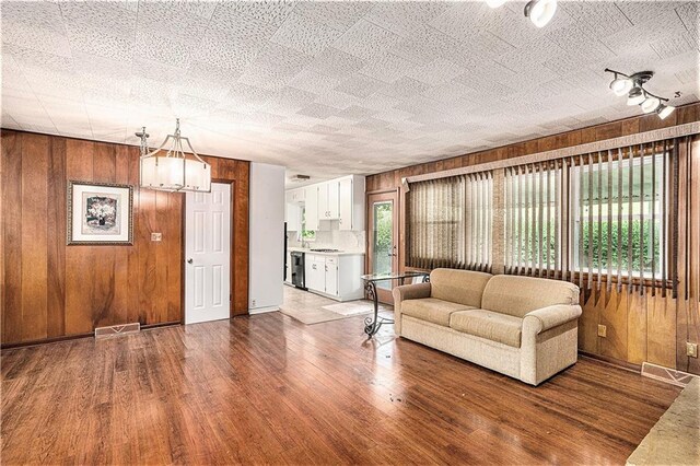 5919 N Adrian Ter, Kansas City, MO 64152 - living area with wood walls and wood finished floors