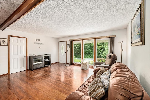 5919 N Adrian Ter, Kansas City, MO 64152 - living room with hardwood / wood-style flooring and a textured ceiling