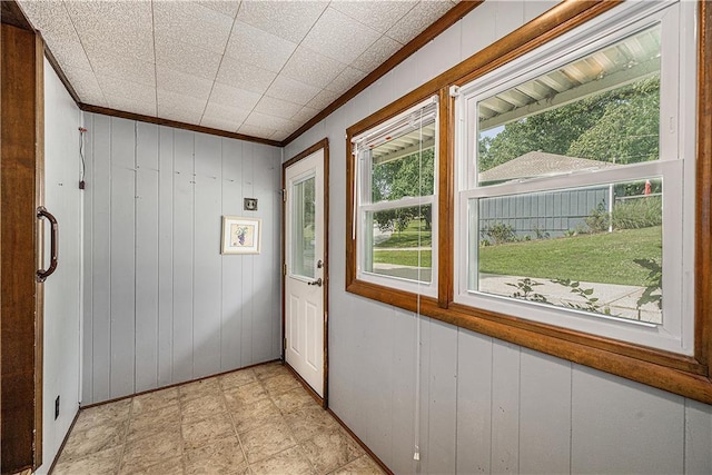 5919 N Adrian Ter, Kansas City, MO 64152 - doorway featuring crown molding and wooden walls