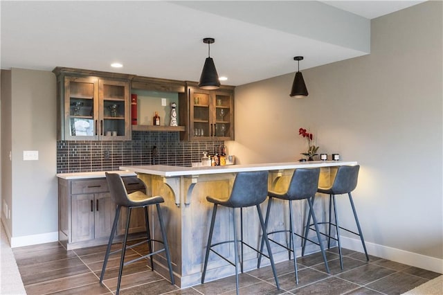 1113 Hummingbird Ct, Greenwood, MO 64034 - indoor wet bar with decorative backsplash, pendant lighting, and recessed lighting
