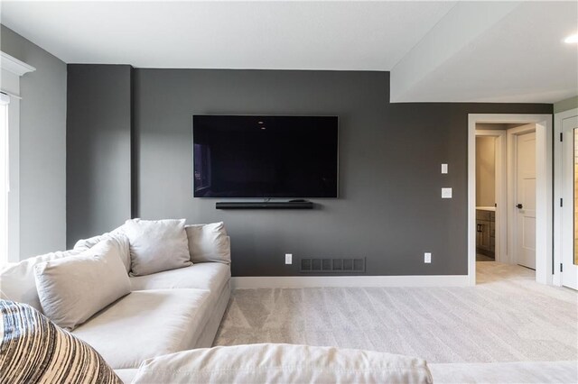 1113 Hummingbird Ct, Greenwood, MO 64034 - carpeted living area featuring baseboards