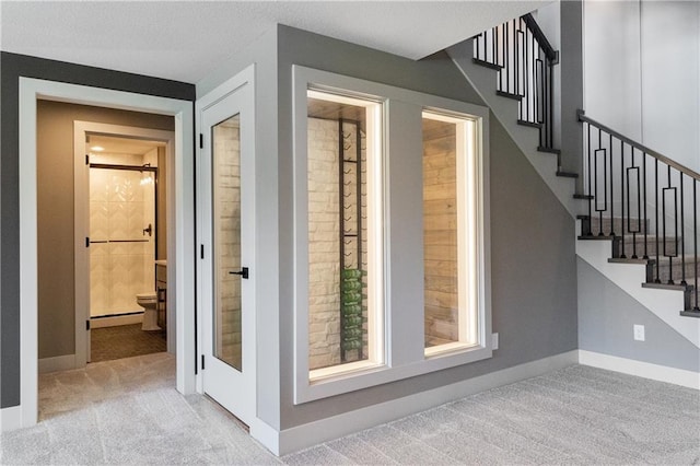 1113 Hummingbird Ct, Greenwood, MO 64034 - stairs featuring carpet floors and baseboards