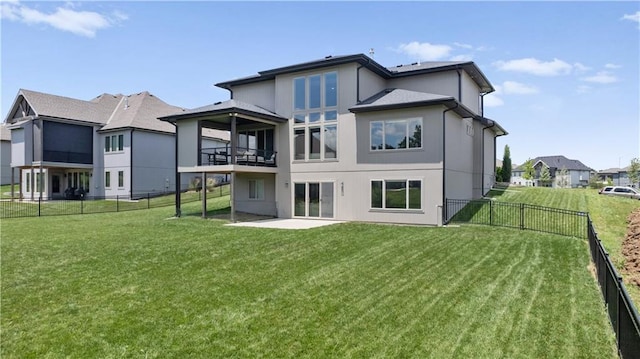 1113 Hummingbird Ct, Greenwood, MO 64034 - rear view of property featuring a balcony, a fenced backyard, stucco siding, and a patio area