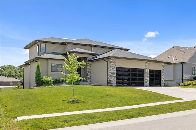 1113 Hummingbird Ct, Greenwood, MO 64034 - prairie-style house featuring a garage, concrete driveway, and a front lawn
