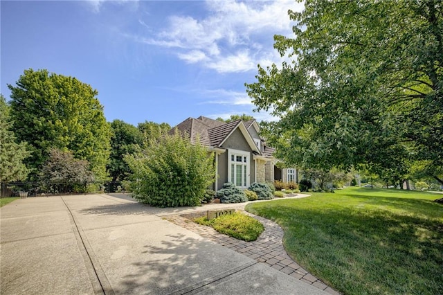 1021 SW Summit Falls Dr, Lees Summit, MO 64081 - view of property hidden behind natural elements with stucco siding