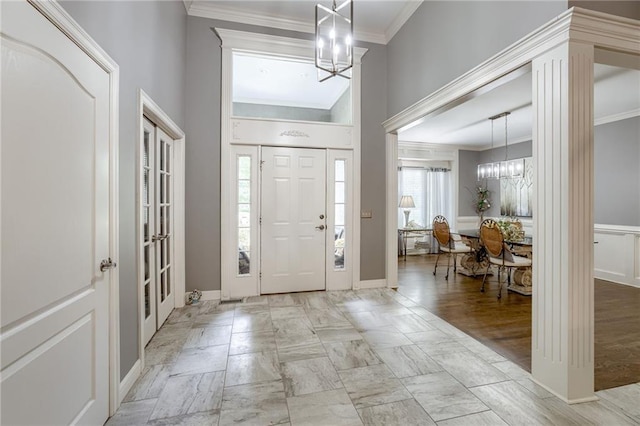 1021 SW Summit Falls Dr, Lees Summit, MO 64081 - entrance foyer featuring a chandelier and crown molding
