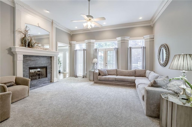 1021 SW Summit Falls Dr, Lees Summit, MO 64081 - carpeted living area with ceiling fan, ornamental molding, recessed lighting, and a fireplace with flush hearth