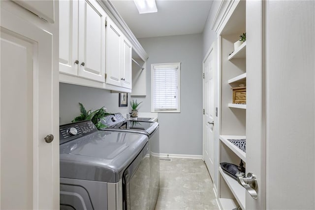 1021 SW Summit Falls Dr, Lees Summit, MO 64081 - laundry room featuring cabinet space and washer and clothes dryer