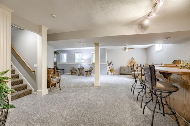 1021 SW Summit Falls Dr, Lees Summit, MO 64081 - indoor bar featuring track lighting, carpet flooring, stairs, and a textured ceiling